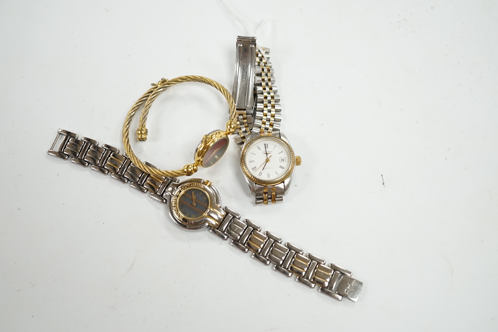 Two lady's steel and gold plated Longines wrist watches, including automatic, and a lady's Gucci wrist watch. Condition - poor to fair